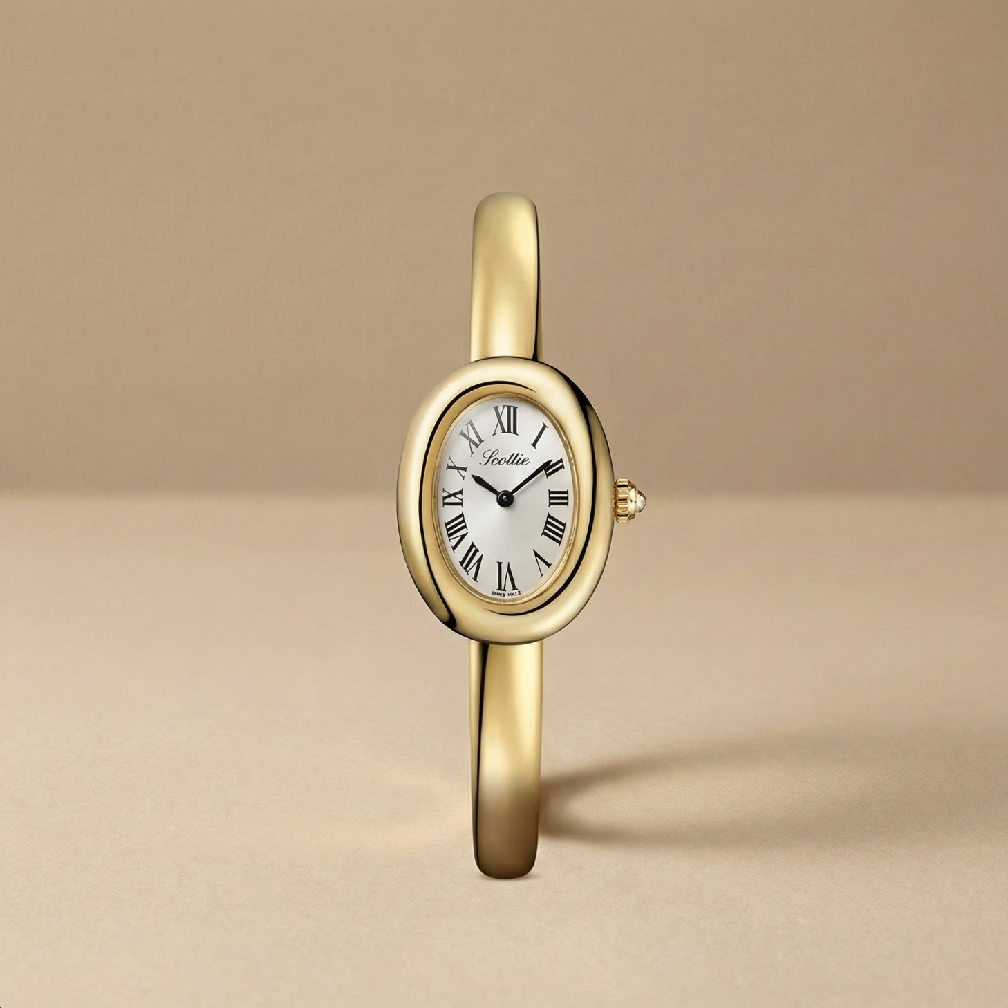 Gold wristwatch with white dial on a beige background
